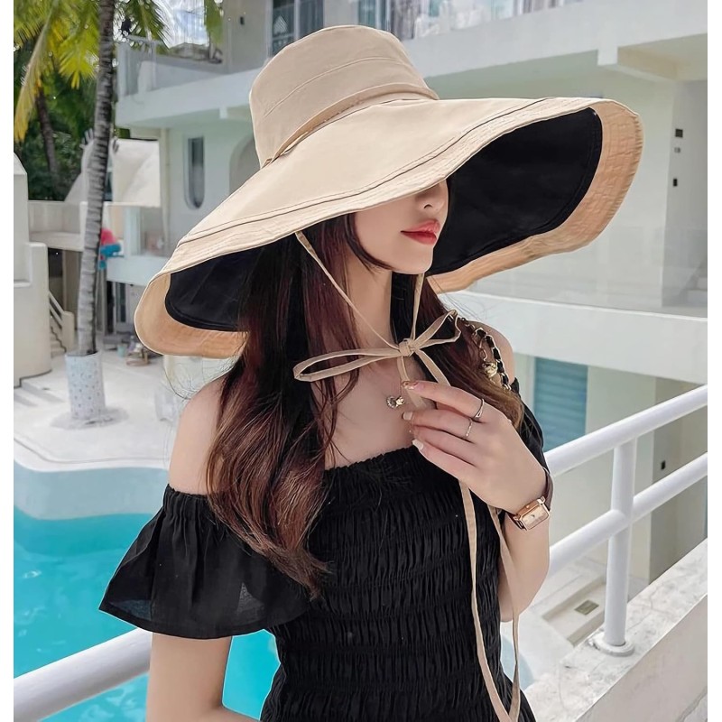 Woman wearing reversible wide brim sun hat with UV protection at beach