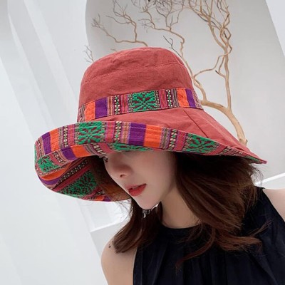 Women wearing wide brim sun hat with UPF 50+ protection at beach