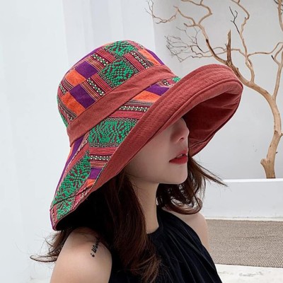 Women wearing wide brim sun hat with UPF 50+ protection at beach