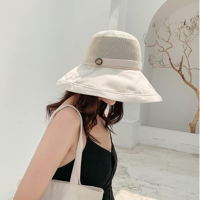 Women wearing a wide brim sun hat with mesh crown, wired edge, and chin strap for UV protection outdoors