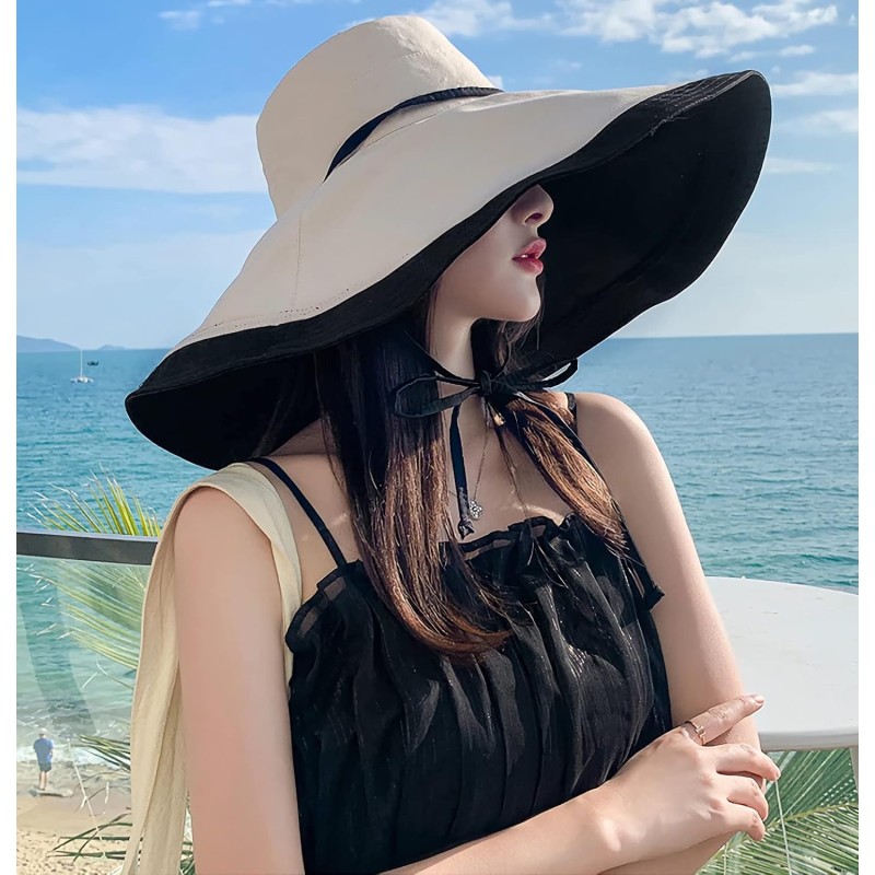 Woman wearing a reversible wide brim sun hat with UV protection at the beach
