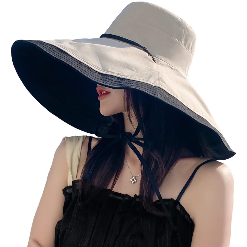 Woman wearing a reversible wide brim sun hat with UV protection at the beach