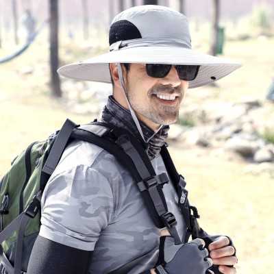 Men and women wearing wide brim bucket hat with UV protection and water repellent fabric for fishing hiking and beach