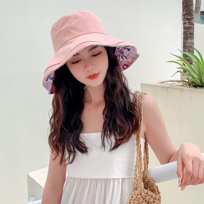 Women's reversible floral bucket sun hat with wide brim and UV protection