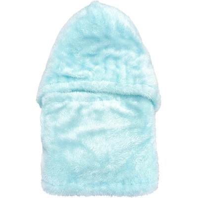 Woman wearing a fleece lined one piece beanie scarf in snowy winter scene