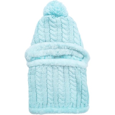 Woman wearing a fleece lined one piece beanie scarf in snowy winter scene