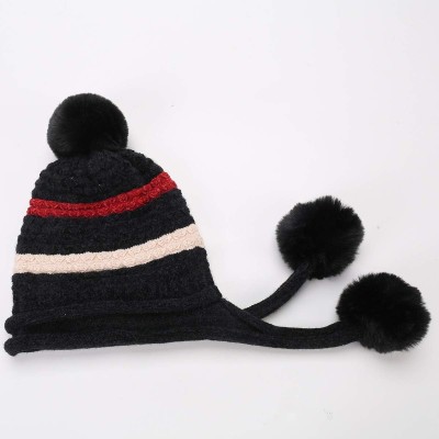 Black women’s Peruvian knit beanie with ear flaps, pom poms, fleece lining, ponytail friendly