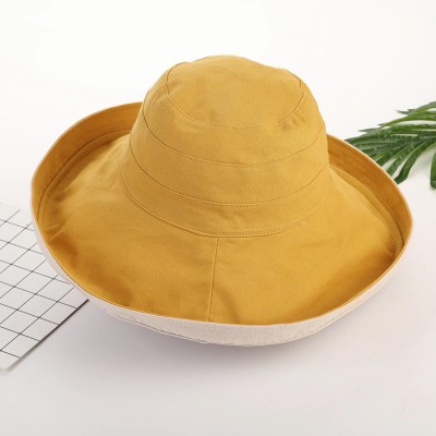 Women's yellow wide brim reversible sun hat with wired edge and chin strap