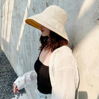 Women's yellow wide brim reversible sun hat with wired edge and chin strap