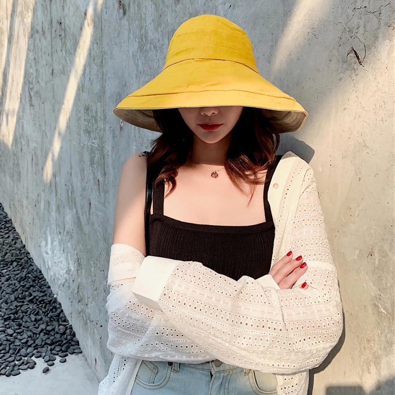 Women's yellow wide brim reversible sun hat with wired edge and chin strap