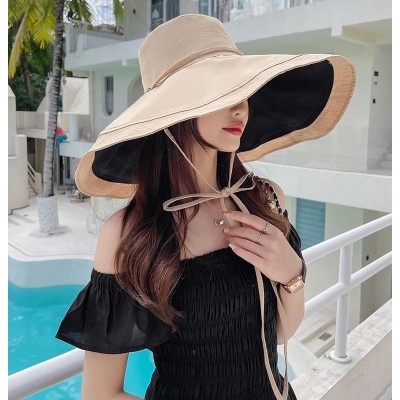 Women's Reversible Wide Brim Sun Hat – UV Protection & Foldable Woman wearing reversible wide brim sun hat with UV protection at beach