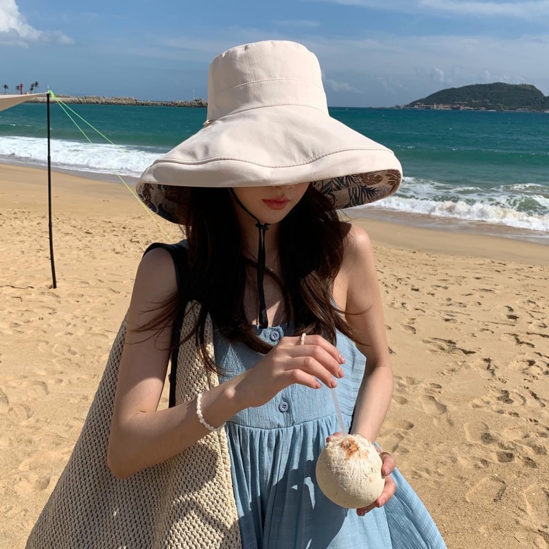 Women's Reversible Wide Brim Sun Hat - UV Protection Women wearing reversible wide brim sun hat with wired edge for UV protection