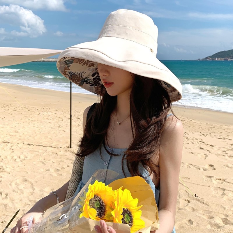 Women's Reversible Wide Brim Sun Hat - UV Protection Women wearing reversible wide brim sun hat with wired edge for UV protection