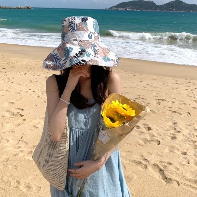 Women's Reversible Wide Brim Sun Hat - UV Protection Women wearing reversible wide brim sun hat with wired edge for UV protection