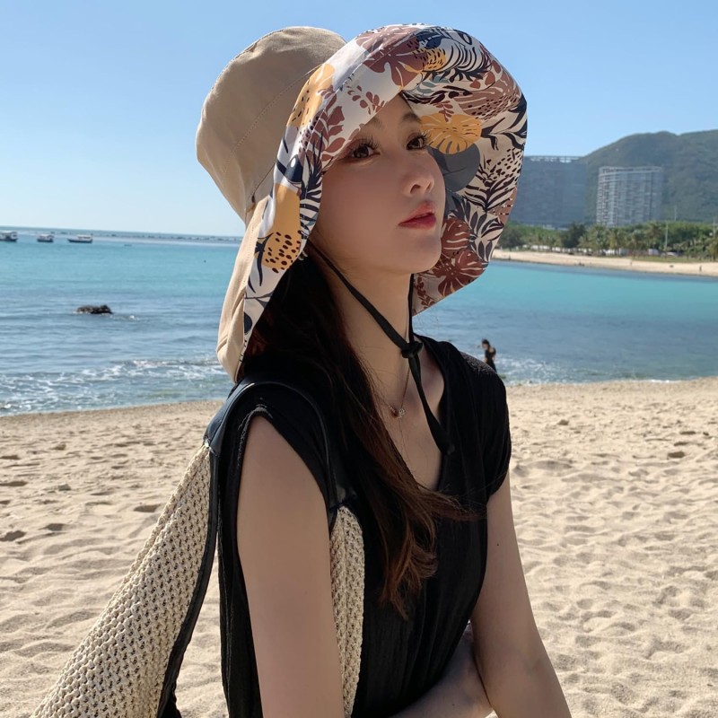 Women's reversible wide brim sun hat with UV protection, packable for travel and beach