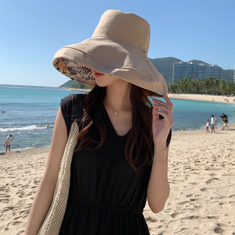 Women's reversible wide brim sun hat with UV protection, packable for travel and beach