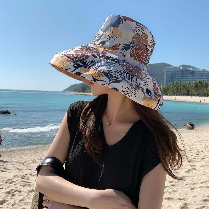 Women's reversible wide brim sun hat with UV protection, packable for travel and beach