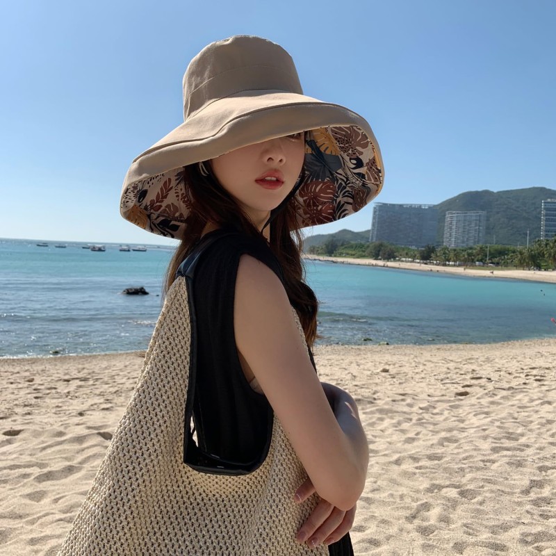 Women's reversible wide brim sun hat with UV protection, packable for travel and beach