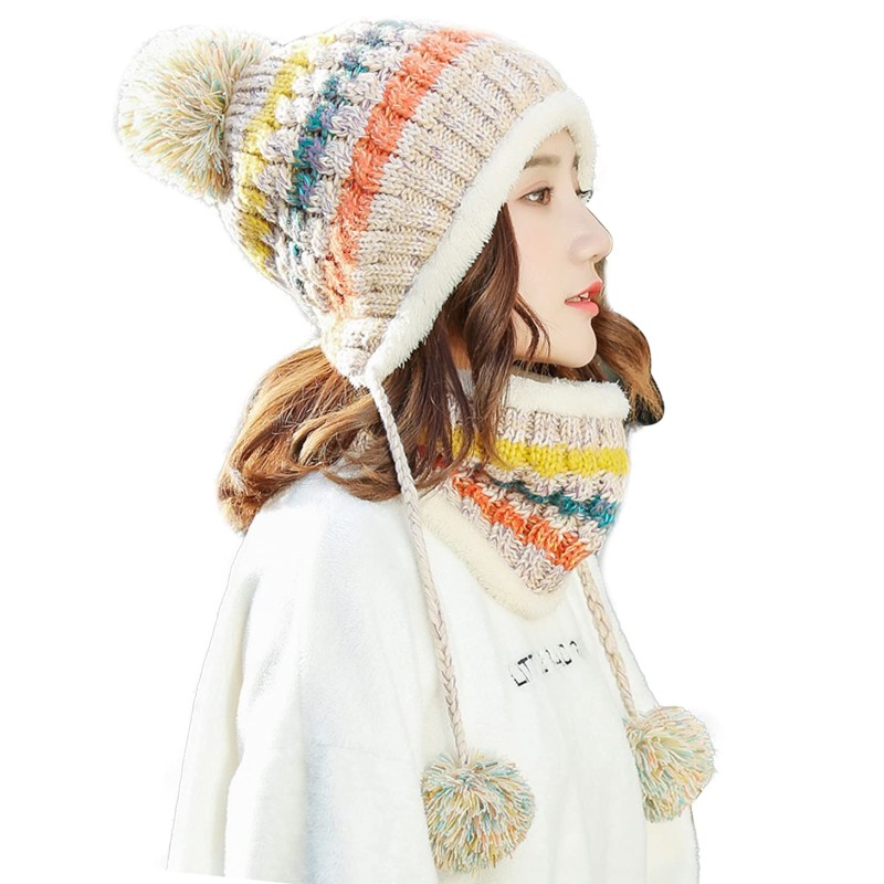 Women wearing fleece-lined winter beanie and circle scarf set with ear flaps and pompom