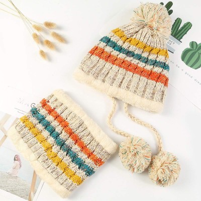 Women wearing fleece-lined winter beanie and circle scarf set with ear flaps and pompom