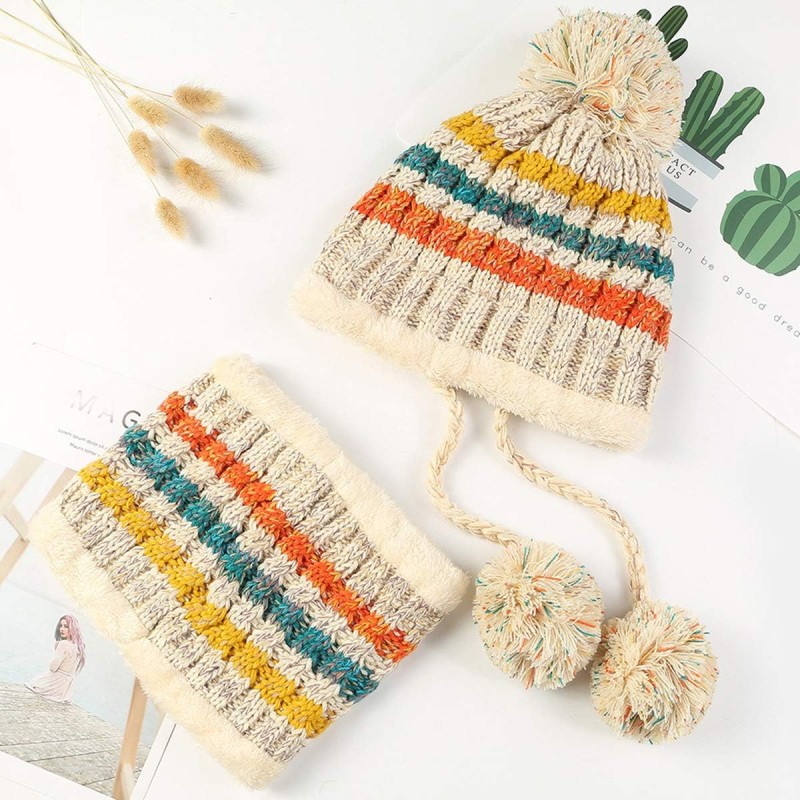 Women wearing fleece-lined winter beanie and circle scarf set with ear flaps and pompom